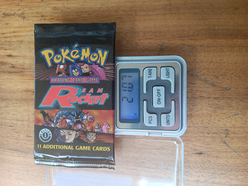 WOTC 1st Edition Team Rocket Booster Pack (weighing 21.07)| Treasure Collectables WOTC 1st Edition Team Rocket Booster Pack (weighing 21.07)| Treasure Collectables